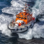 Ilustrasi kapal tugboat. (Freepik)